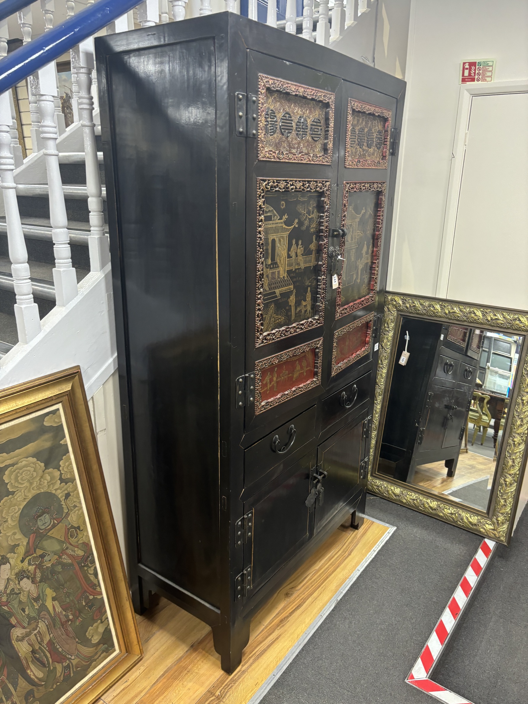 A Chinese lacquered side cabinet, width 109cm, depth 50cm, height 203cm